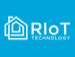 The image displays the logo for RIoT Technology, featuring a stylized house icon on the left with overlapping lines. The bold letters "RIoT" are placed next to it, followed by "TECHNOLOGY" in smaller font. The background is a solid light blue color.